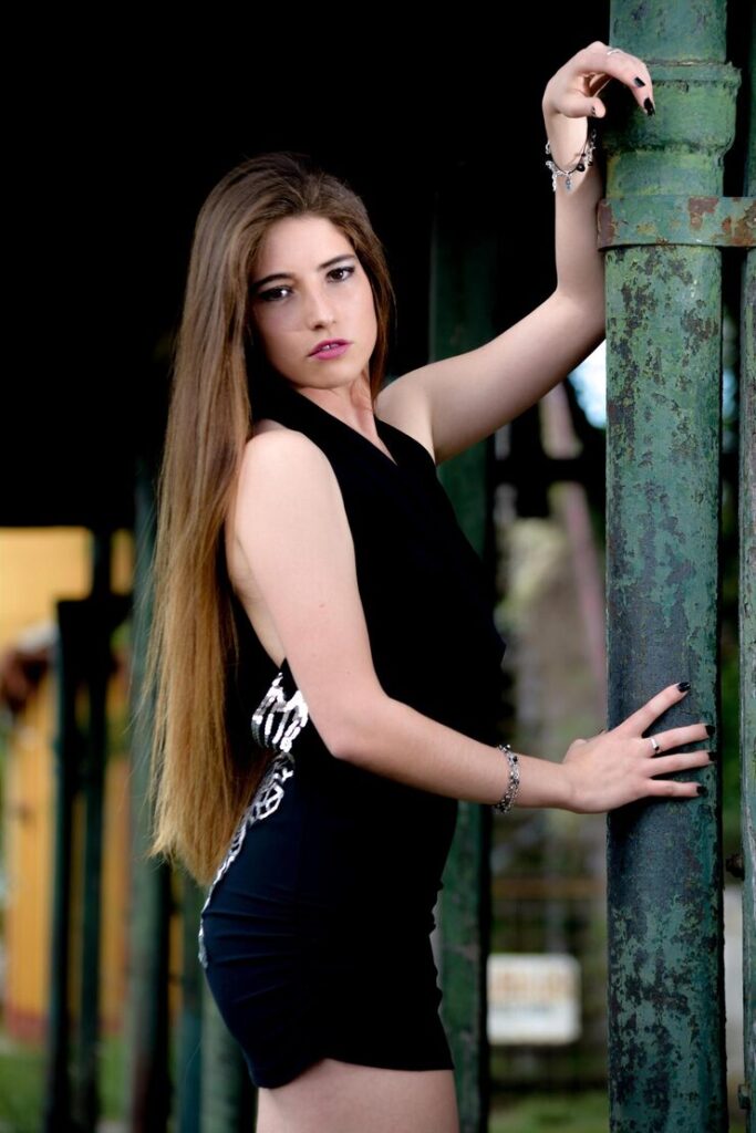 portrait fashion model standing pipe by Escorts in Mumbai